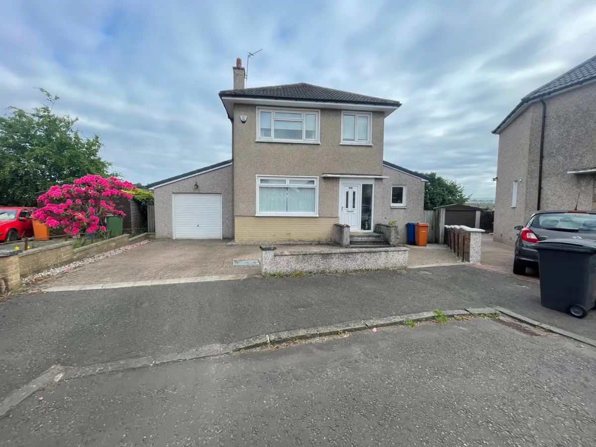 Bearsden driveway before the work: a low wall along the front of the drive